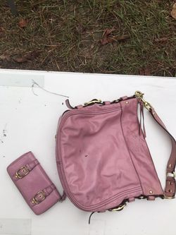 100% authentic Retired Coach bag with matching wallet!