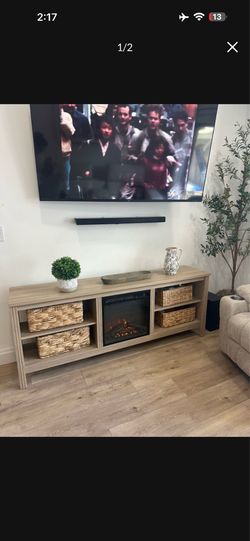 TV stand comes with baskets and fireplace