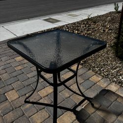 Glass and metal dark grey bistro/outdoor table