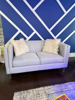 Gray Tufted Loveseat with Acrylic Legs