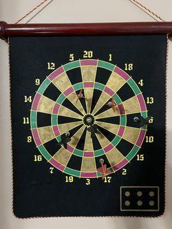 Colourful Dartboard With Darts