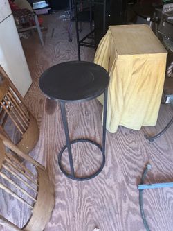 A plant stand it’s 28 inches tall and 13 inches across the top