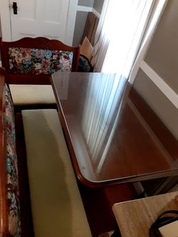 Glass top table with two bench seats