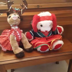 A Puppy And A Deer Dressed For Christmas