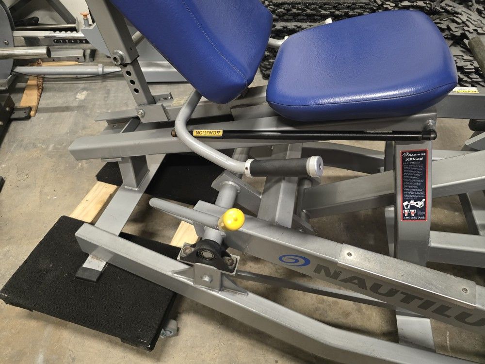Nautilus xpload seated leg press workout fitness plate loaded gym equipment exercise