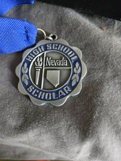 The Honor Society of Phi Kappa Phi medallion and Nevada honor society