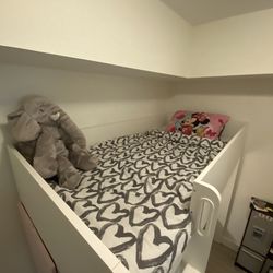 Child’s bunk bed with desk
