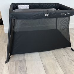 Travel play yard with crib blackout cover