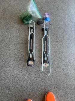 (2) High-quality Steadyrack wall mounted pivoting bicycle racks for efficient storage solutions.
