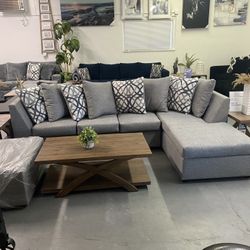Grey Sectional With Designed Pillows 