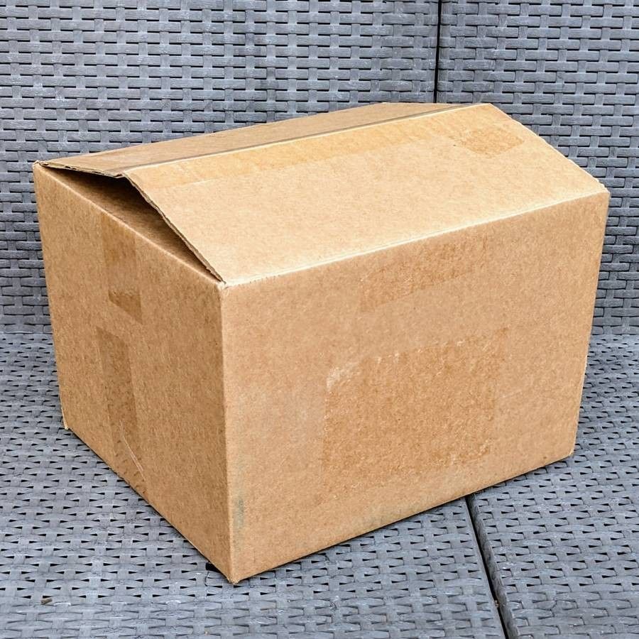 Clean small size cardboard box with peanuts for shipping moving or storage