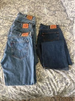 4 pair of 501 Levi jeans
