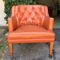 St Timothy executive orange chair casters tufted