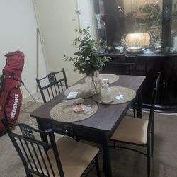 dining set featuring a metal and wood table