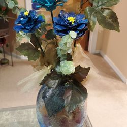 6 in by 5 in blue speckled vase with pine cone  flowers