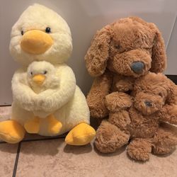 Mama duck and puppy with their babies