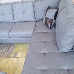BRAND NEW SECTIONAL COUCH WITH STORAGE OTTOMAN