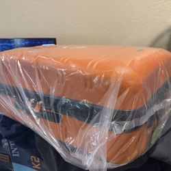 Rockland Melbourne Hardside Expandablew Luggage with Spinner Wheels Orange 3 Piece Set for $75