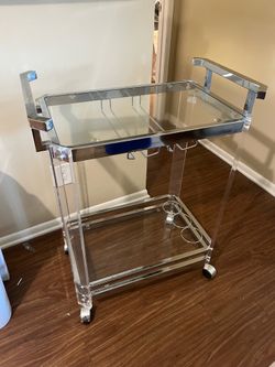 Glass bar cart on wheels
