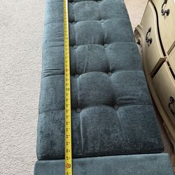 Teal fabric trunk for end of bed