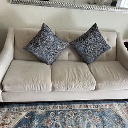 Couche And Accent Chair Along With Blue Pillows