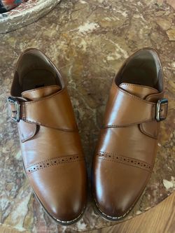 Boys dressing shoes