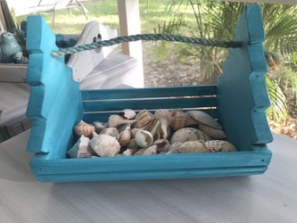 Teal basket with shells