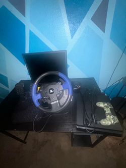 Thrust master steering wheel set with a PS4 slim and custom controller Thrust master steering wheel set with a PS4 slim and custom controller