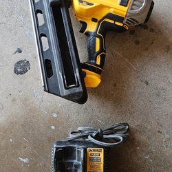 DEWALT 20V MAX XR Brushless Cordless Framing Nailer and a DEWALT DCB107 charge