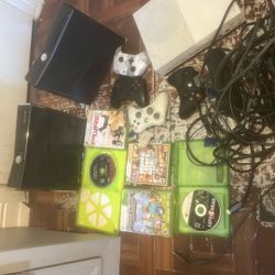 Two Xbox 360,one White Xbox, Two Black Controllers,one White Controller,5 Xbox Games 