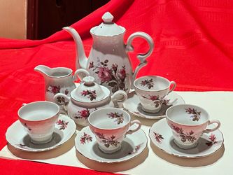 Floral teapot set with cups and saucers