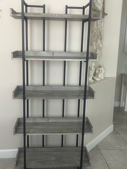 Tall black & grey standing shelving unit