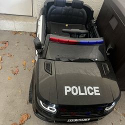 baby ride on police car battery powered with remote control, Bluetooth for music. And charger included.