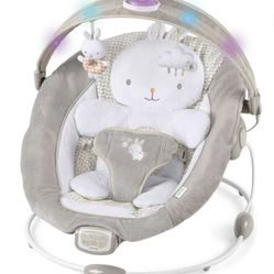 Ingenuity InLighten Twinkle Tails Vibrating Infant Baby Bouncer with Lightning Toy Bar and Pillow