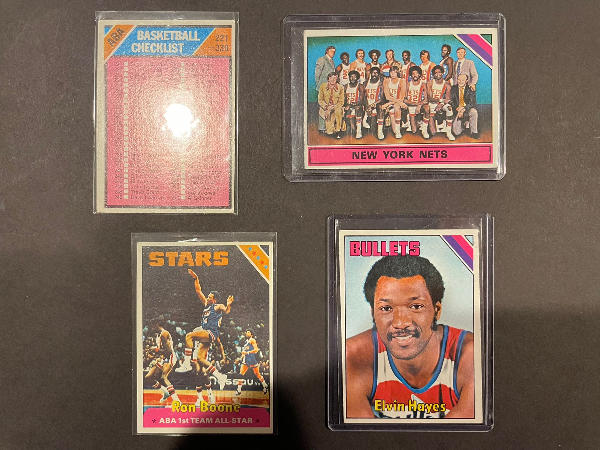 (4) 1975 Topps Basketball Cards ABA checklist #257, New York Nets Checklist #325, Ron Boone AS #235, Elvin Hayes #60 EX-MT