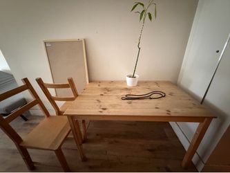 Wooden kitchen table with two chairs