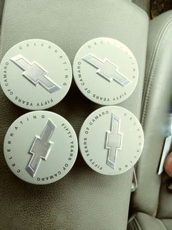 Chevy camaro celebrating fifty of camaro center caps