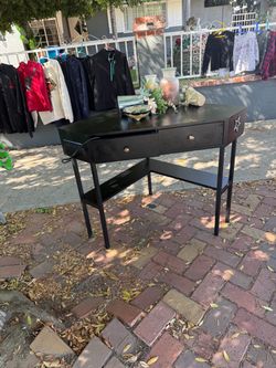 Small corner black desk with outlet and ports