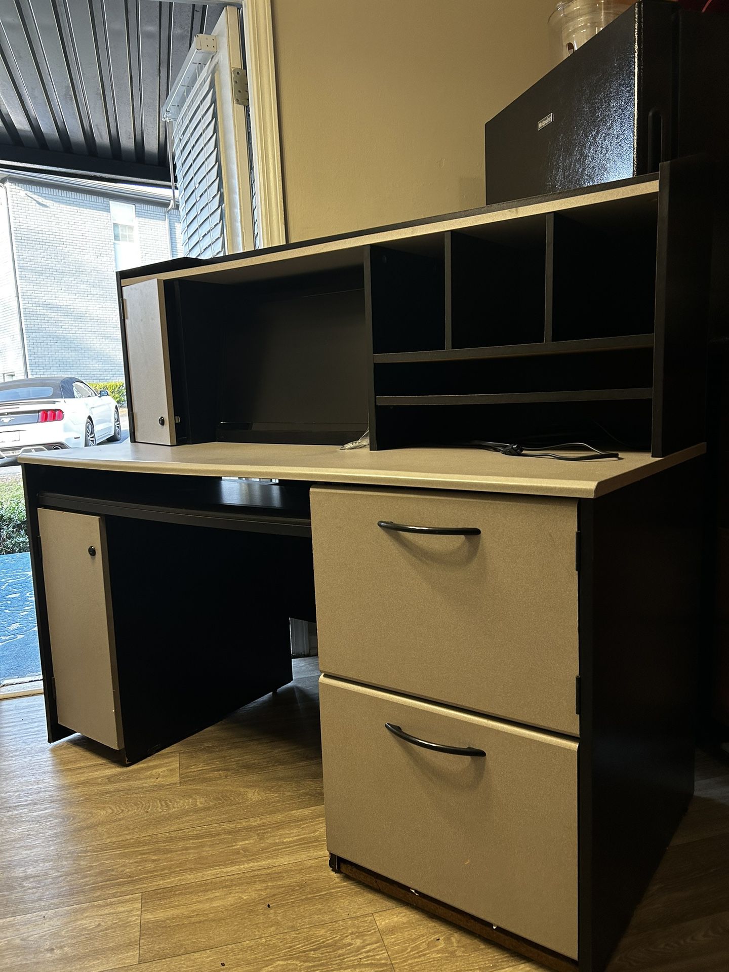 Desk with locking cabinets (key included) filing cabinets, built in visio monitor and keyboard tray