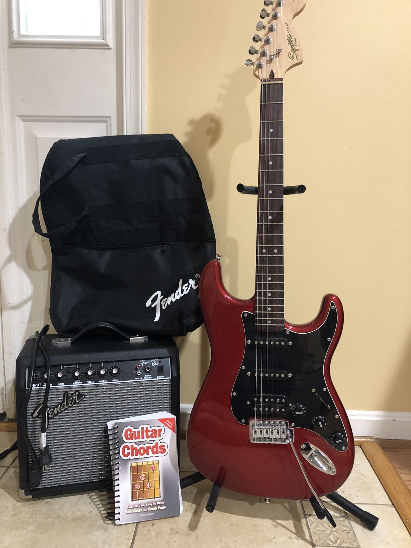 Fender Squire Guitar, Amp, case, stand and chord book