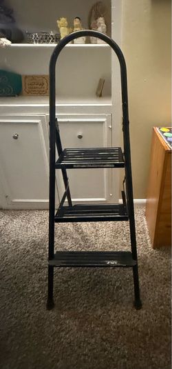 Sturdy black step ladder with three steps. 50" height One step is 6" Other 2 steps are 3" each Great in condition|
