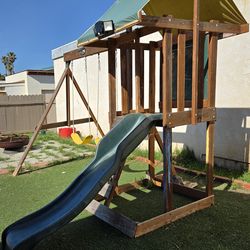 wooden outdoor swing set