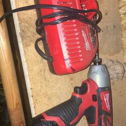Milwaukee Impact Drill And Charger
