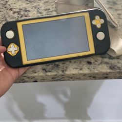 Nintendo Switch Lite With Case And 6 Games ,and And A Box To Have It In From Nintendo