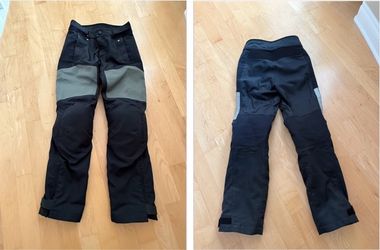 Size US 40 Durable BMW StreetGuard 3 motorcycle pants are black with grey thigh panels. These pants have integrated knee and hip protection. The desig