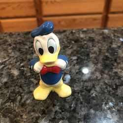 Vintage Disney Donald Duck Ceramic Figure. Size 3 inches tall. Preowned excellent condition no cracks or chips. Has been on display in a cabinet wi