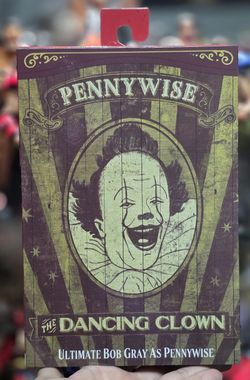 NECA Ultimate Bob Gray as Pennywise The Dancing Clown Welcome To Derry In Hand