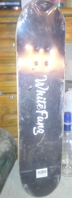 Brand New In Plastic White Fang Skateboard