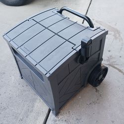 Hose Hideaway for 5/8 inch hose by Suncast with extendable handle and wheels.