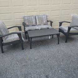 Outdoor patio wicker loveseat with chairs and coffee table 
